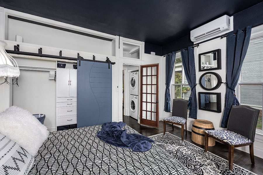 Bedroom w/ Queen bed and sitting area, large closet with triple bypass barn style doors