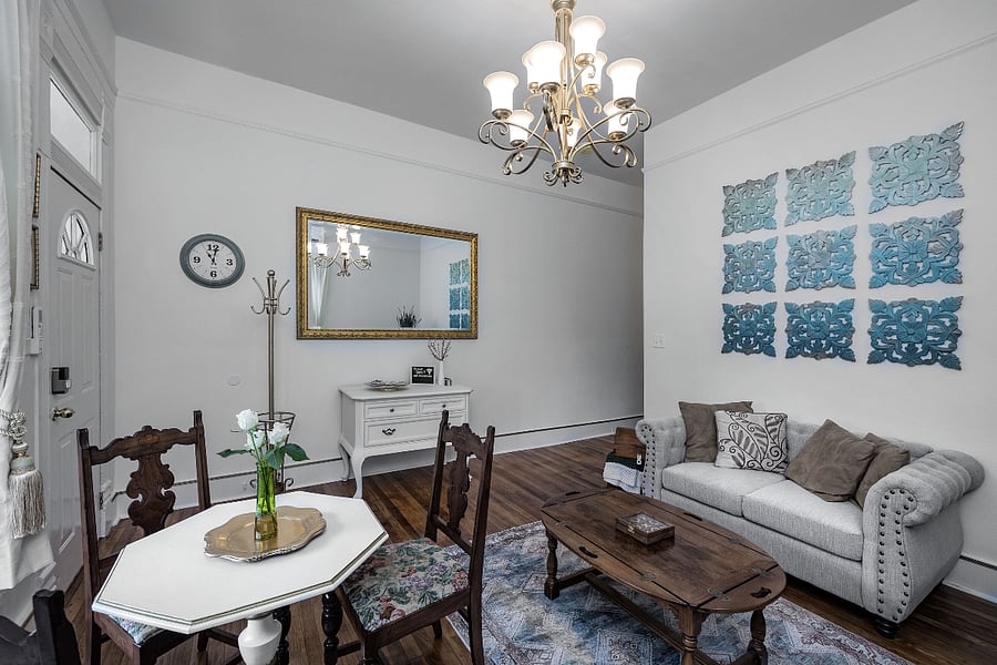 Living/dining space and front entry of suite