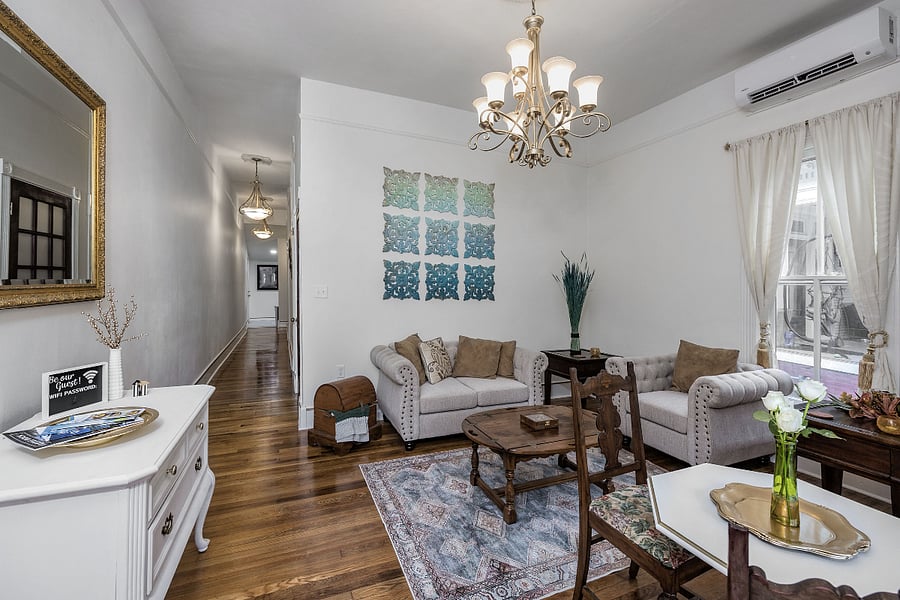 Living/dining space and front entry of suite, hallway
