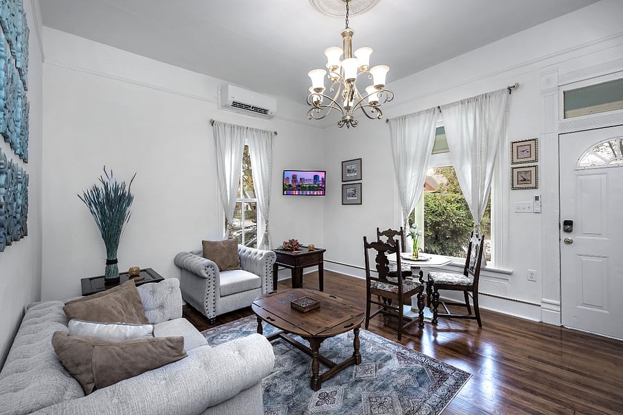Living/dining space and front entry of suite