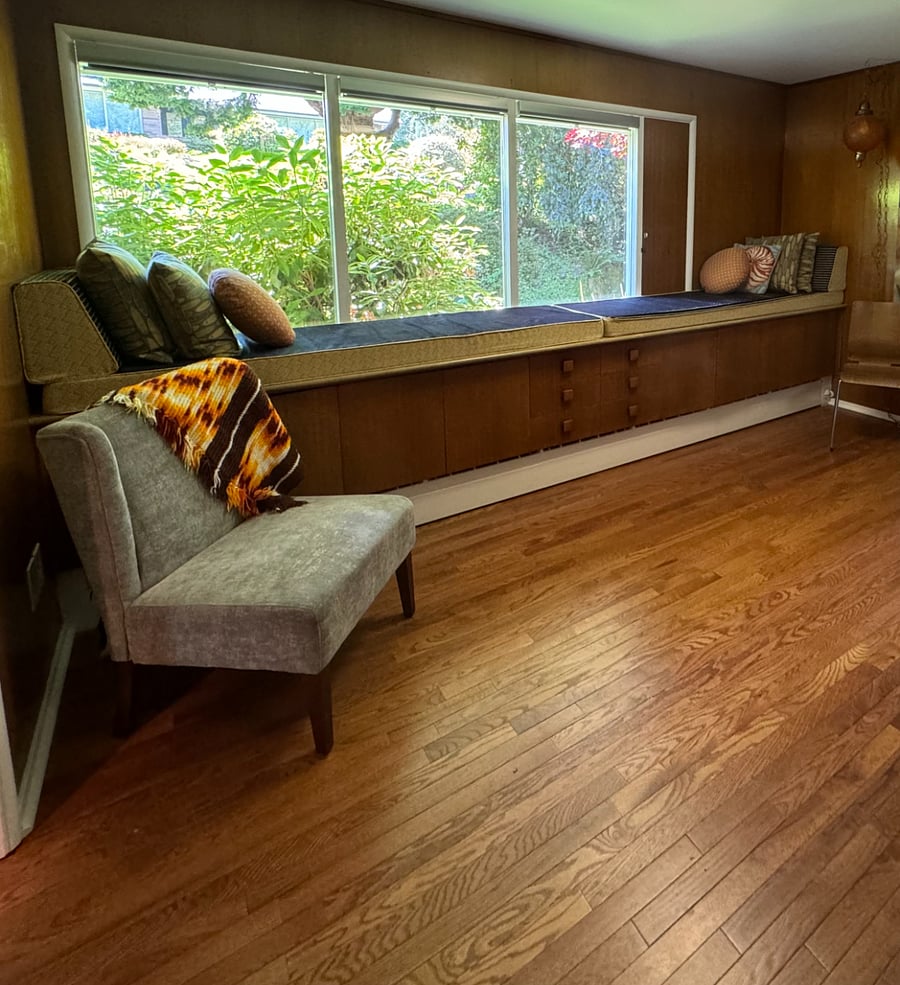 Sunny window seat in the den is perfect for reading.