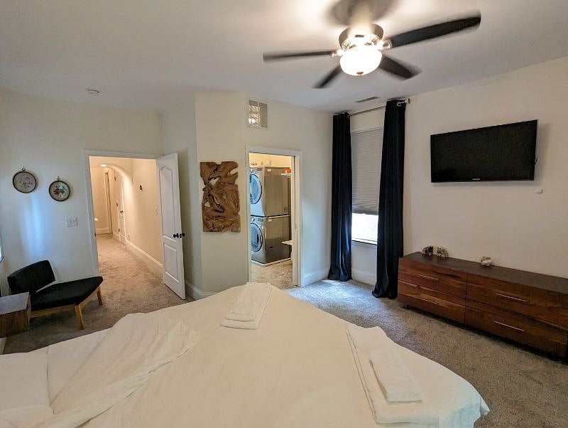Spacious primary bedroom with walk-through closet and en suite bathroom.