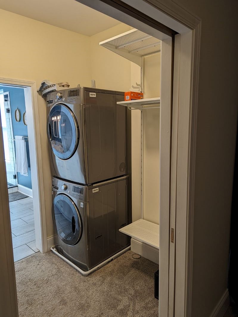 Second floor laundry in the primary bedroom's closet. Extra hanging room inside and to the left.