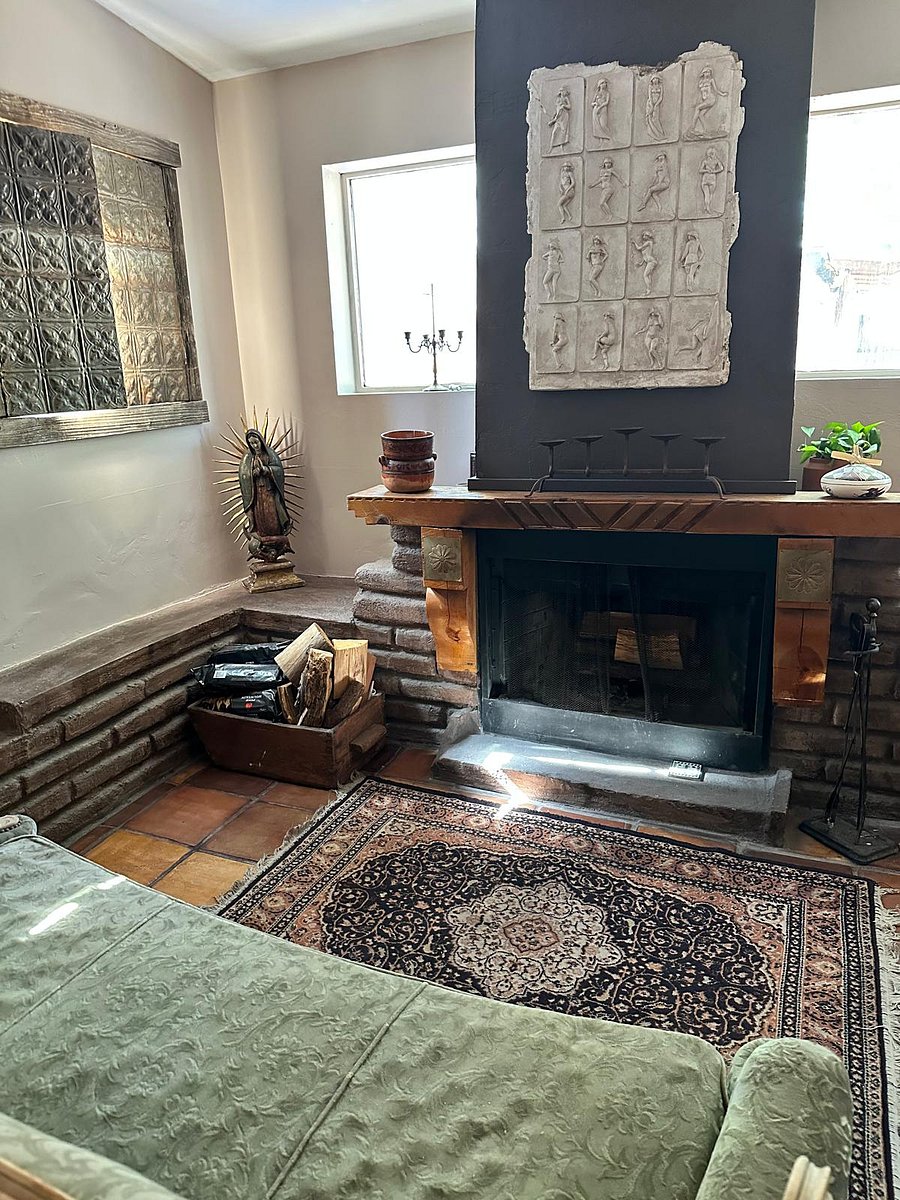 Living room fireplace and seating area.
