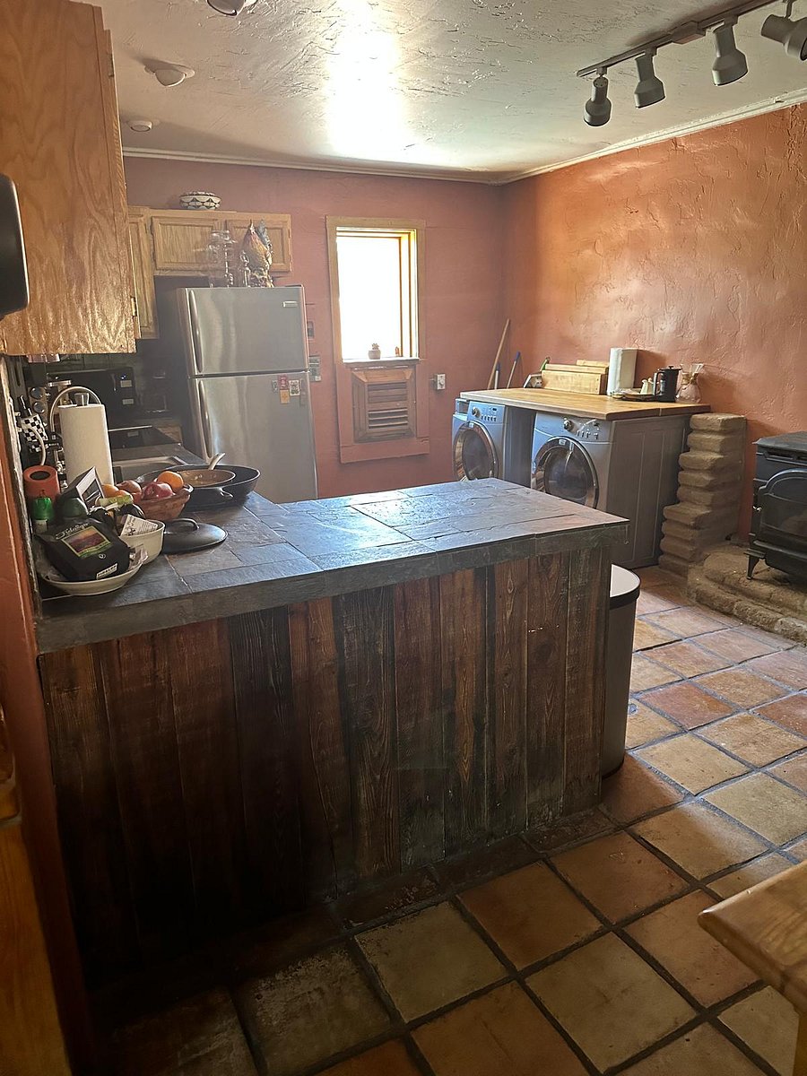 Opposite the Dining Area, you'll find a fully stocked kitchen with lots of space.