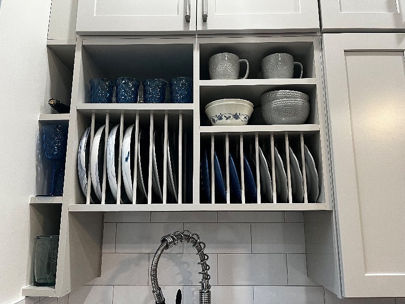 Kitchen: custom open shelving stocked for private meal or for entertaining