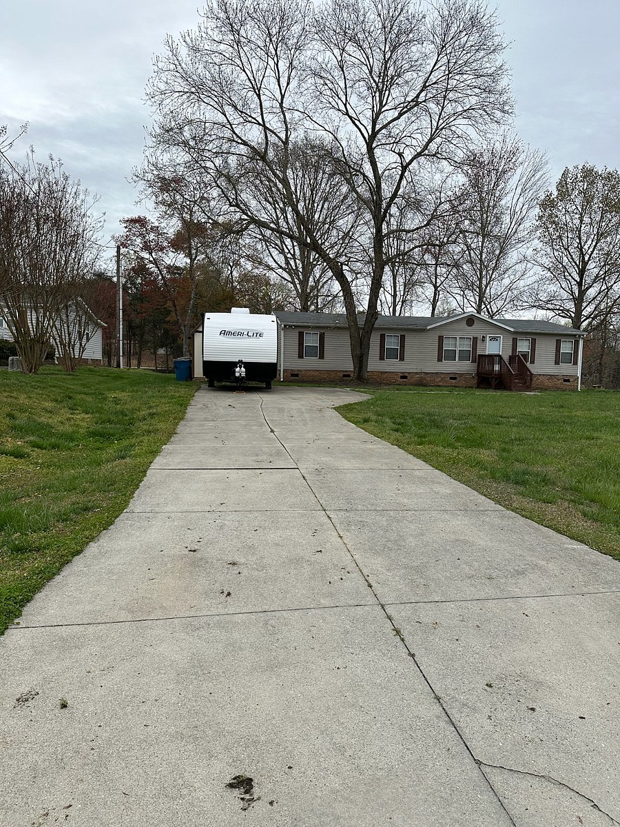 The driveway is shared with this travel trailer.
