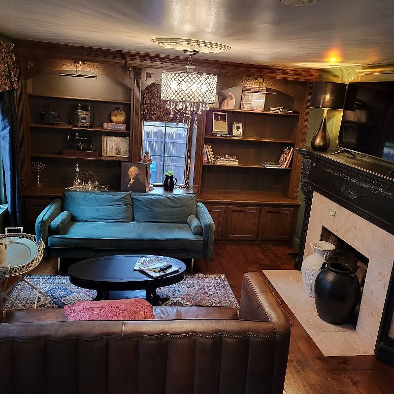 Living room with smart tv and plenty of windows.