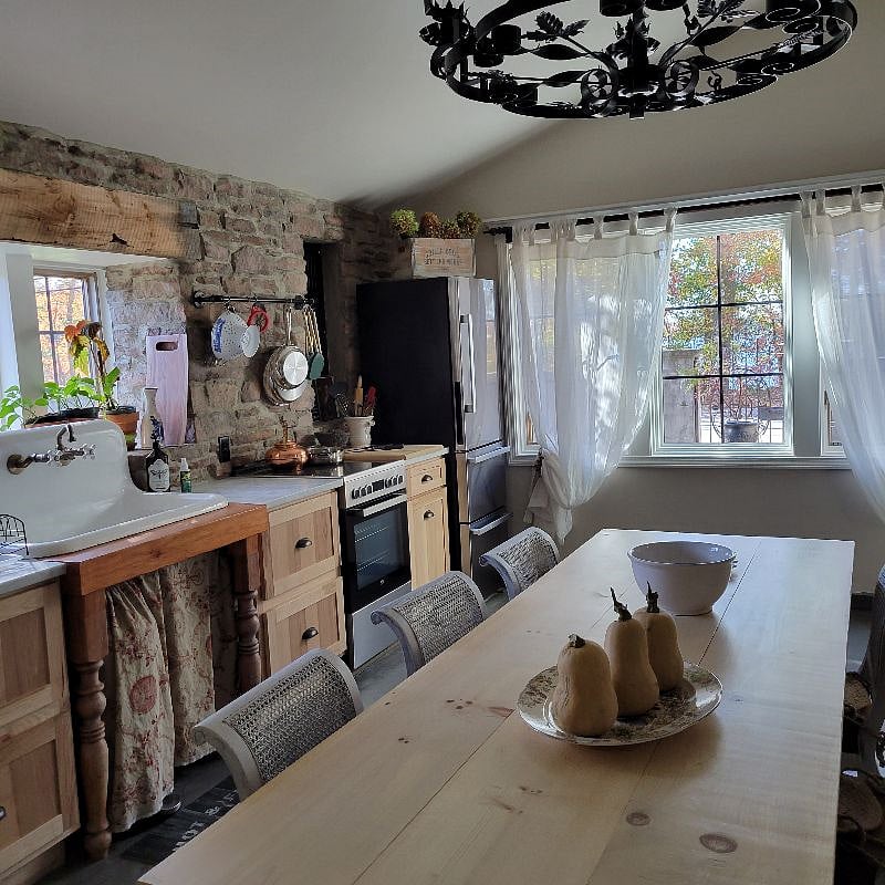 Kitchen with a large farm table a beautiful large window view of the James Turner Reservoir.