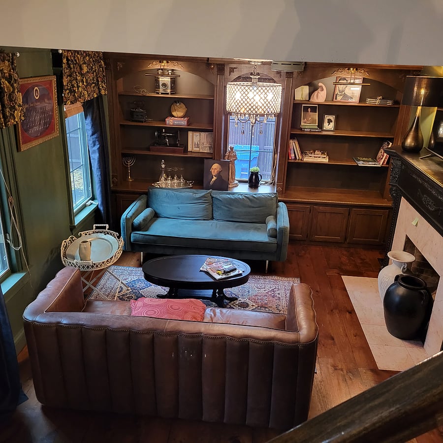 A view of the living room from the top of the stairs.