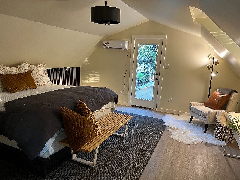 Large bedroom offers reading nook.
