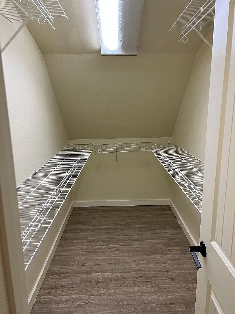 Walk-in closet with lots of storage space.