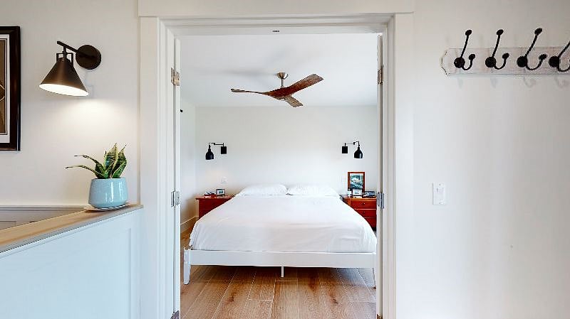 Lower level bedroom with king size bed.