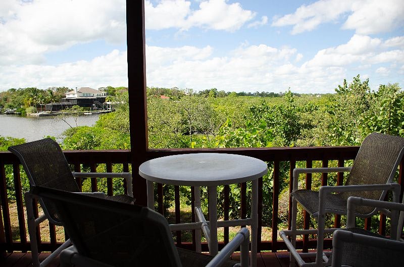 2nd Floor balcony w seating to enjoy a nice cocktail or meal overlooking the water. 