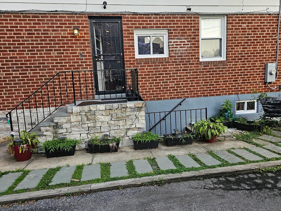 Private entrance to apartment in lower level of home. Parking in driveway near entrance. 