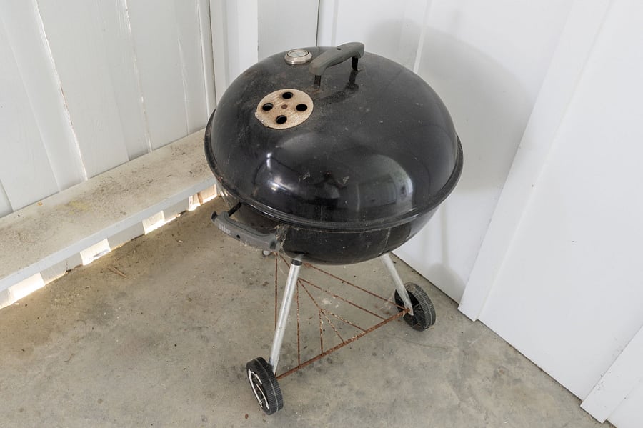 Charcoal Grill located in the Carport