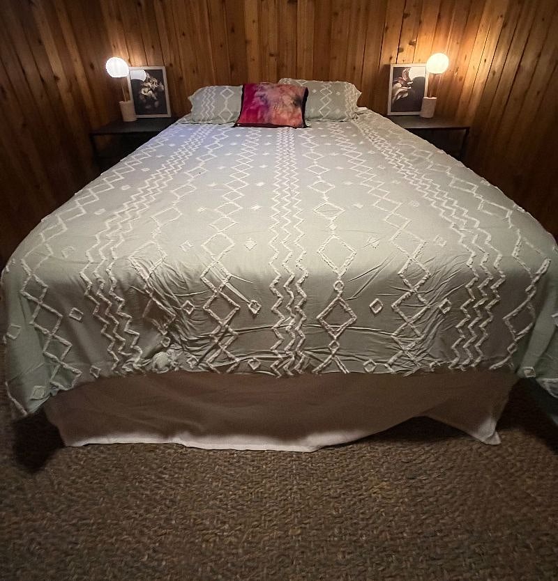 Bedroom complete with modern linens