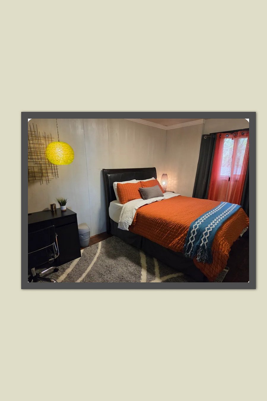 Bedroom #2 is furnished with a queen bed, clothes storage, closet and washer/dryer unit. This bedroom looks out to the Bamboo Garden.