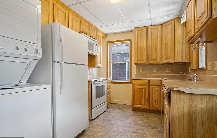 Kitchen is equipped with all appliances and coffee maker.