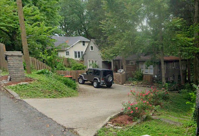 Driveway with gated yard.