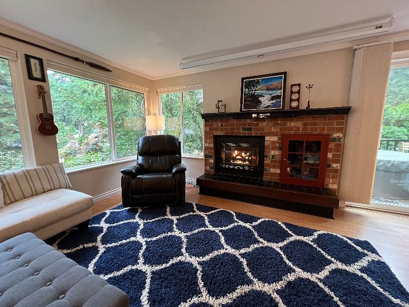 Cozy reading corner with leather electric recliner and gas fireplace