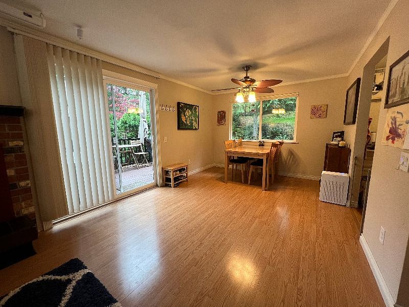Dining area and sliding door that leads to backyard