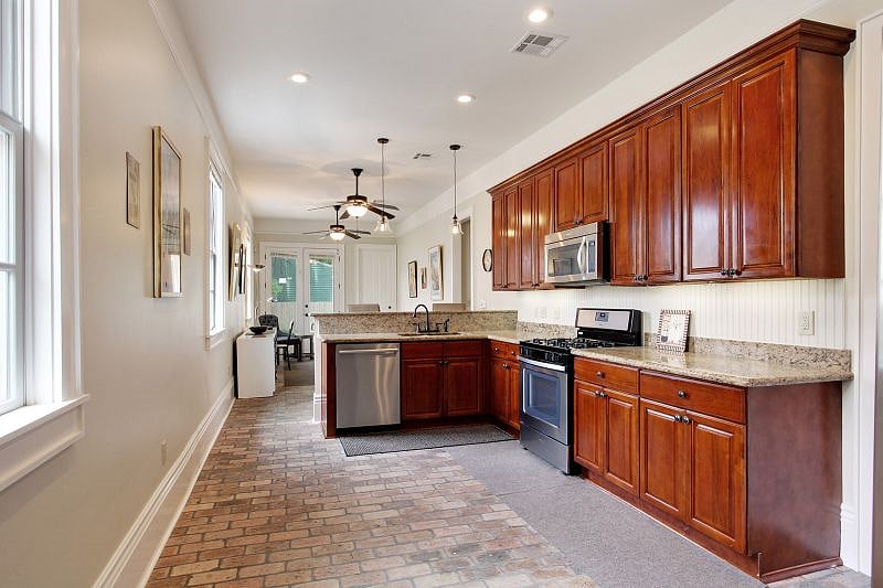 View of kitchen facing the sunroom and back porch