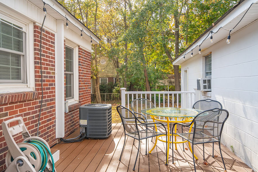 Step out onto the deck, which includes an outdoor dining table for al fresco meals.