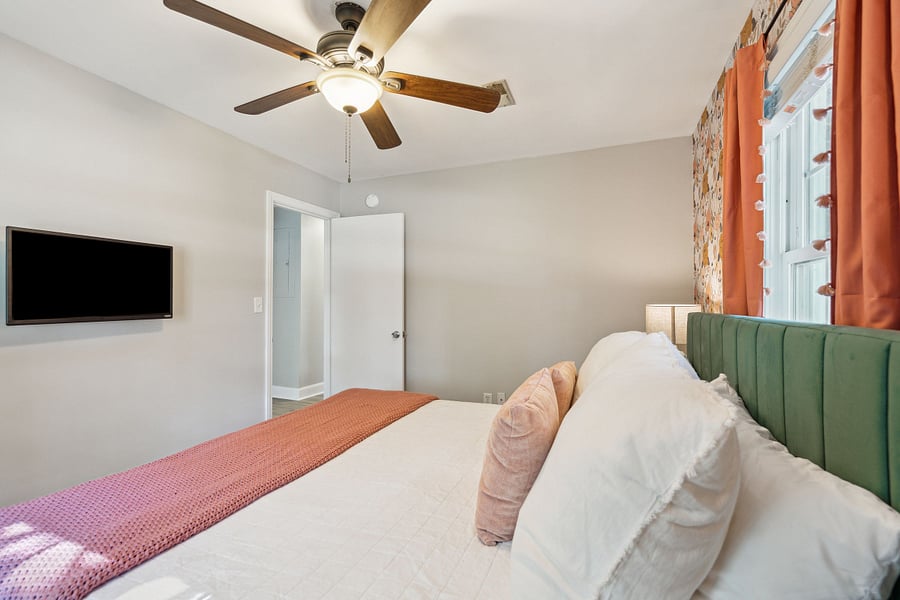 Bedroom #1 features a king bed, small closet, and smart TV. 
