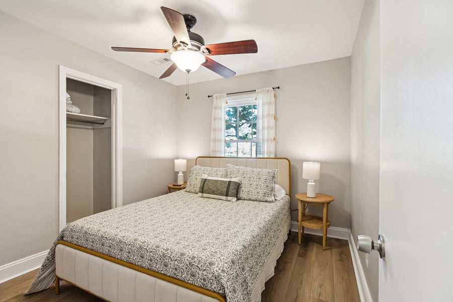Bedroom #2 includes a queen bed, smart TV, and a small closet for clothing storage.
