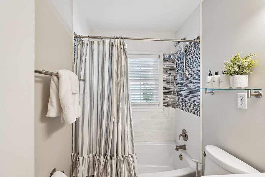The cottage has one full bathroom with a beautifully tiled shower/tub and modern fixtures.
