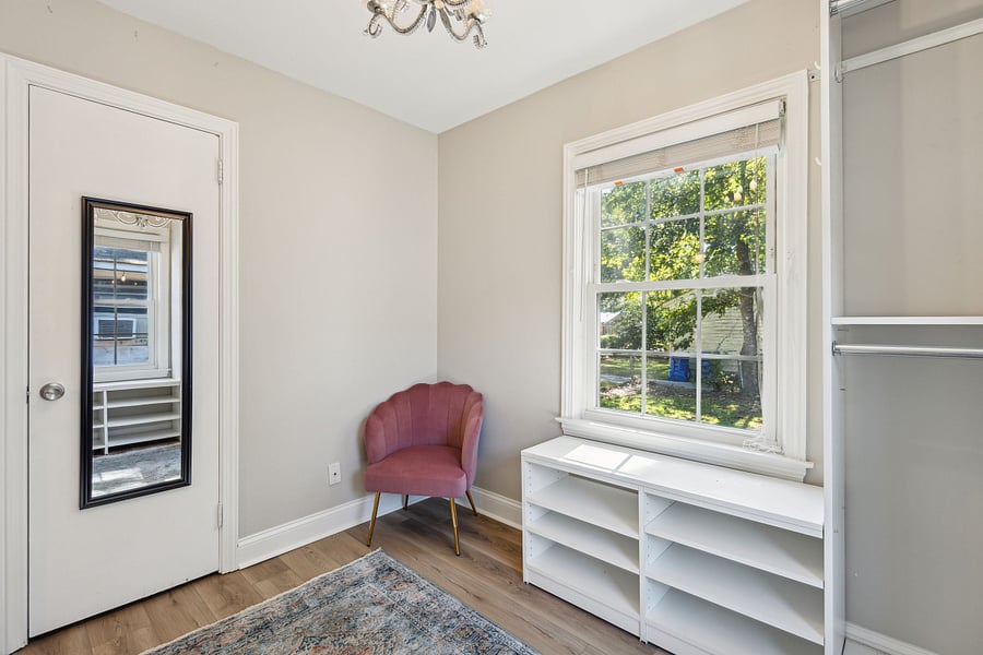 Additional clothing storage for both bedrooms can be found in the room next to bedroom #1. This small room has been converted into a large walk-in closet with built in racks and shelves.
