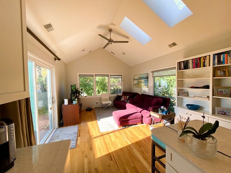 family room which exits to side patio and backyard