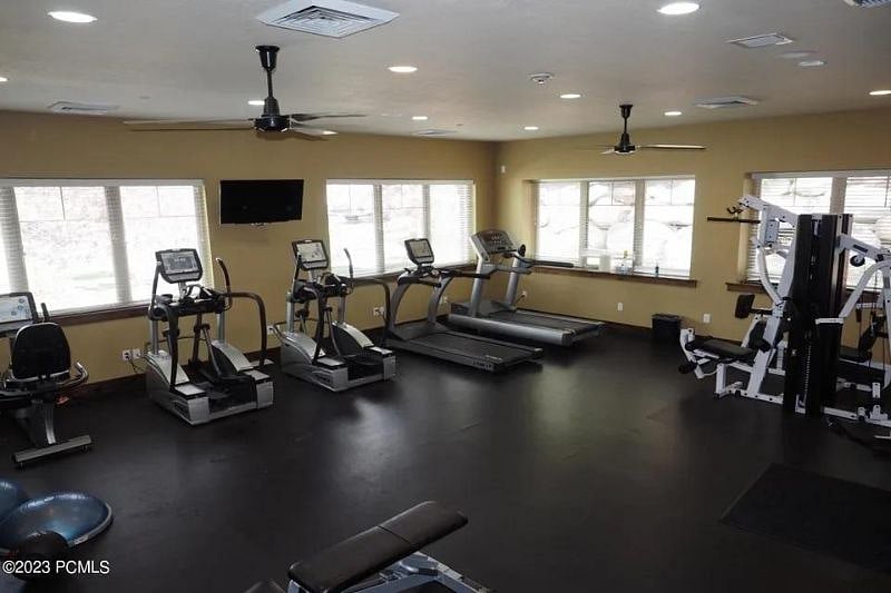 Fitness room with cardio, free weights, yoga mats and more
