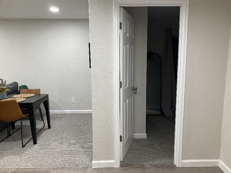 View of dining area and entrance to bedroom
