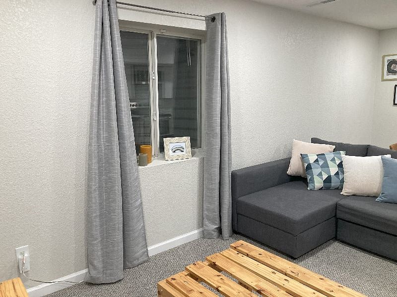 Living room area with sectional couch. 