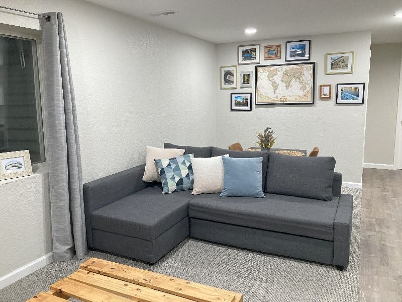 Living room area with dining room in the back.