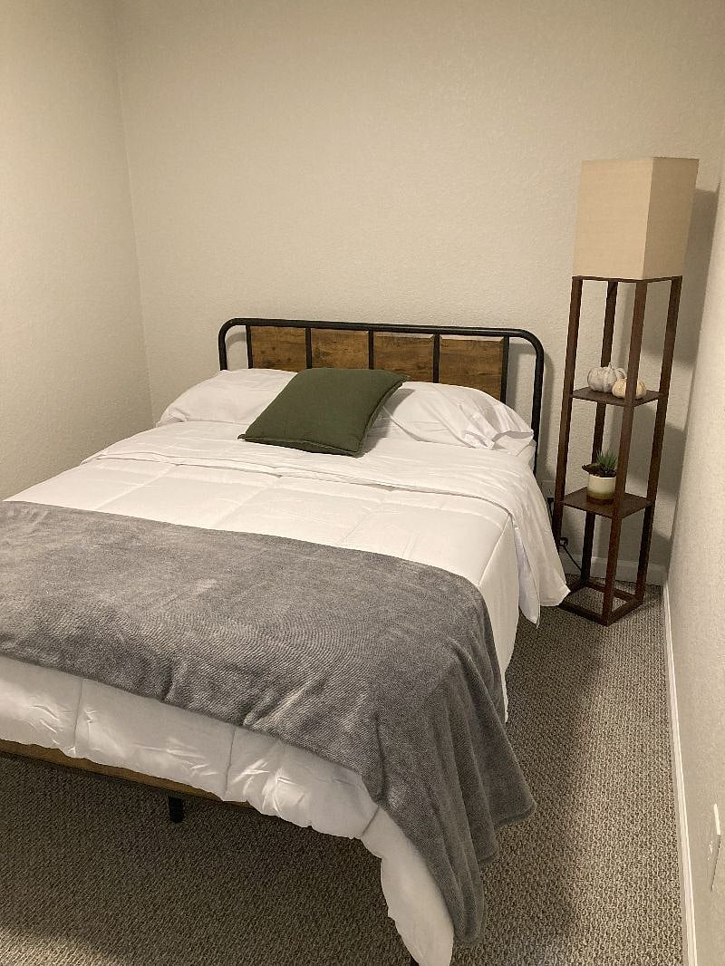 Bedroom with full size mattress.