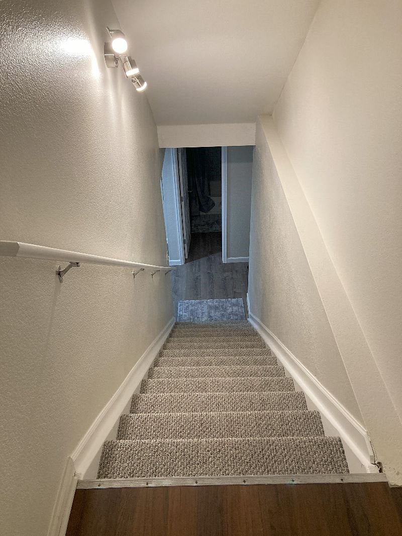 Staircase entrance to basement. Main entrance to the house is not private and through the garage then a door leads to staircase to basement. 