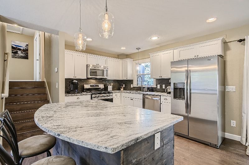 Center island with extra storage, leathered granite throughout