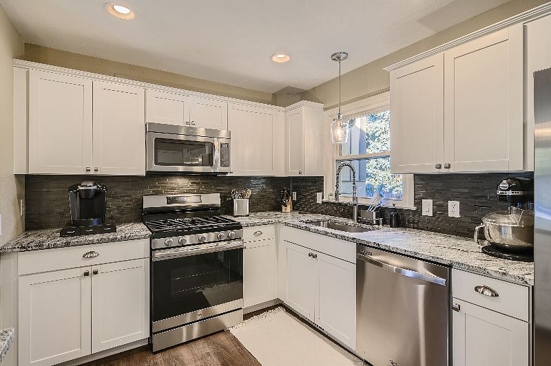 Kitchen with amenities: Keurig, cooking utensils, knife block, kitchen aid stand mixer (other amenities in cabinets/drawers: plates, classes, flatware, baking, toaster, blender, crock pot, hand mixer, starter spice rack, etc.)
