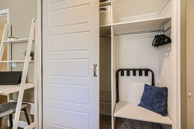 Primary bedroom closet - ample storage, luggage rack, extra linens (similar, with storage, luggage rack and extra linens in all bedroom closets)