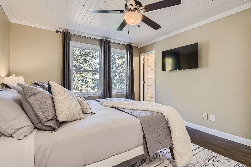 Primary bedroom - room darkening curtains, Roku Smart TV.