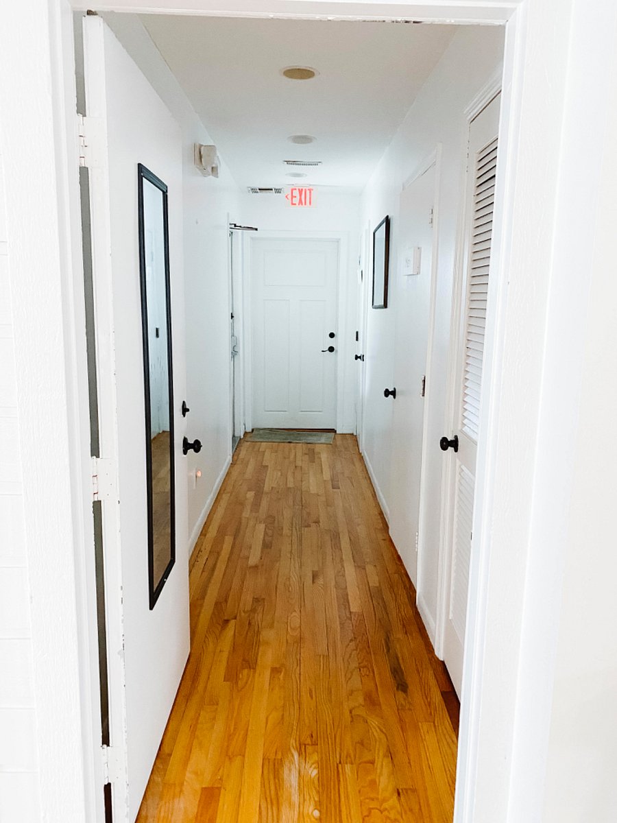 Hallway to shared bathroom