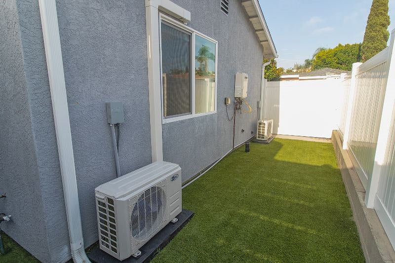 private fenced in yard with turf