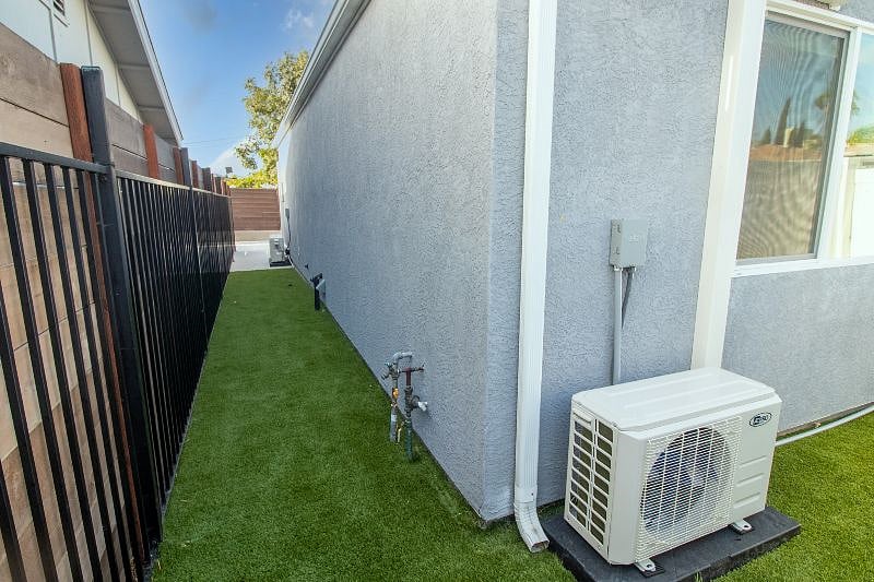 private fenced in yard with turf