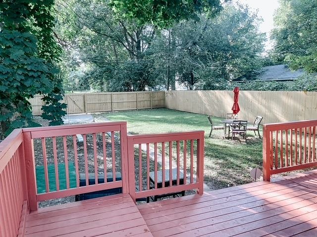 Back deck and fenced inn backyard