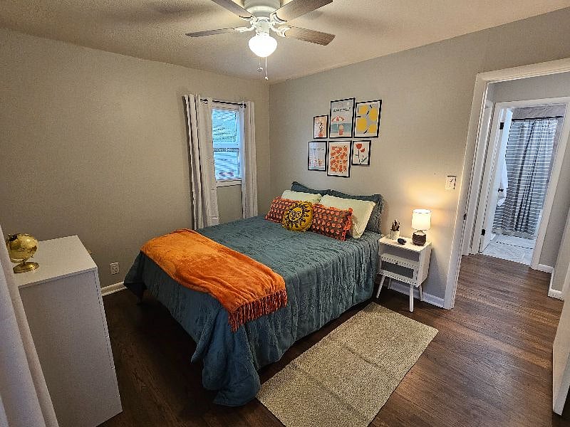Bedroom has blinds and blackout curtains, dresser, nightstand with outlets and usb