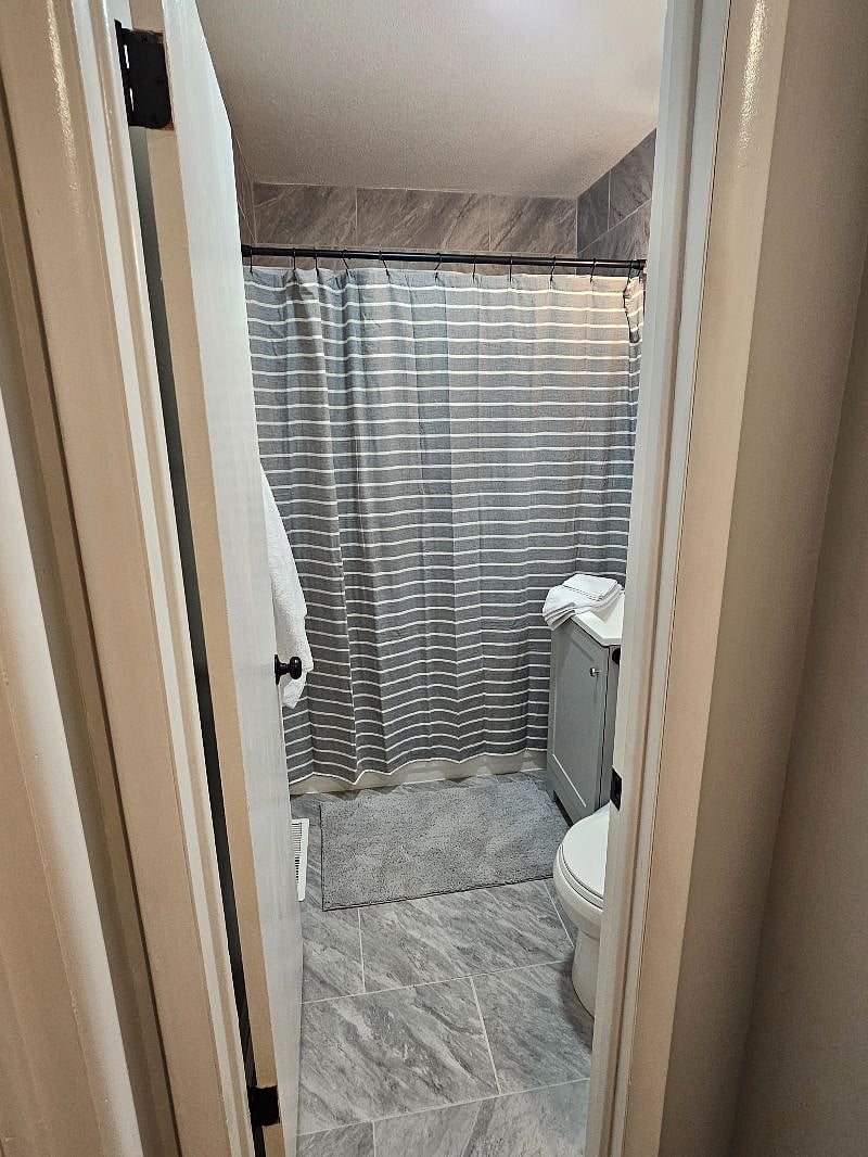 Starter bathroom cleaning supplies and toilet paper included