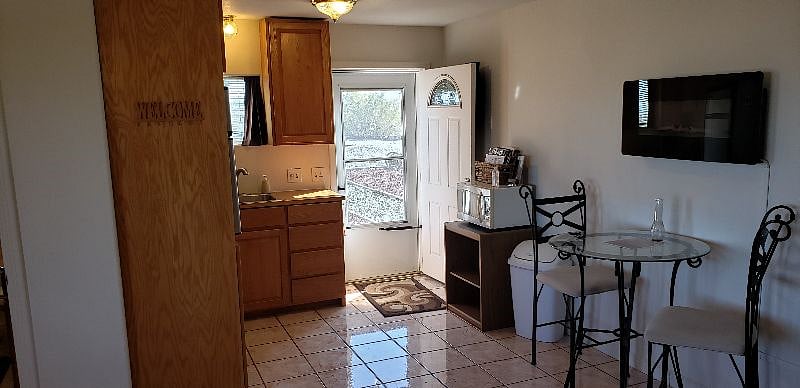 Looking past the kitchen out the door
